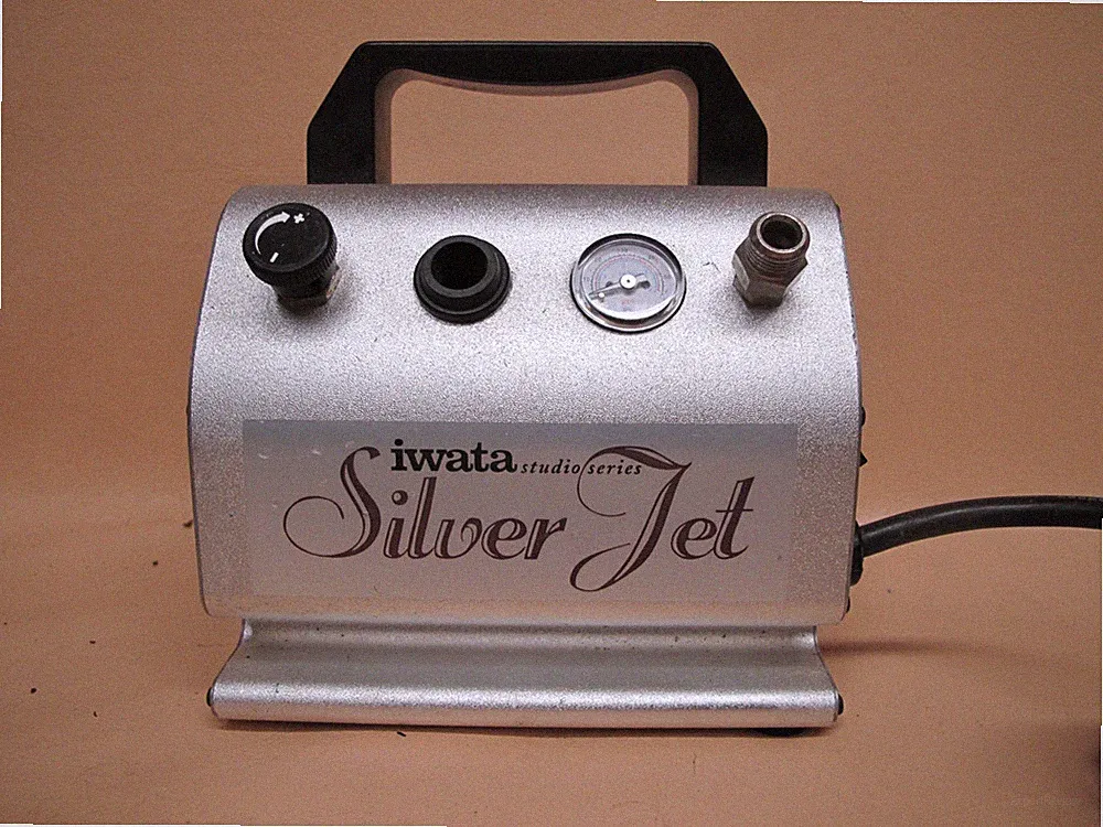 See video Iwata studio series Silver Jet model ac-27 air compressor airbrush tan